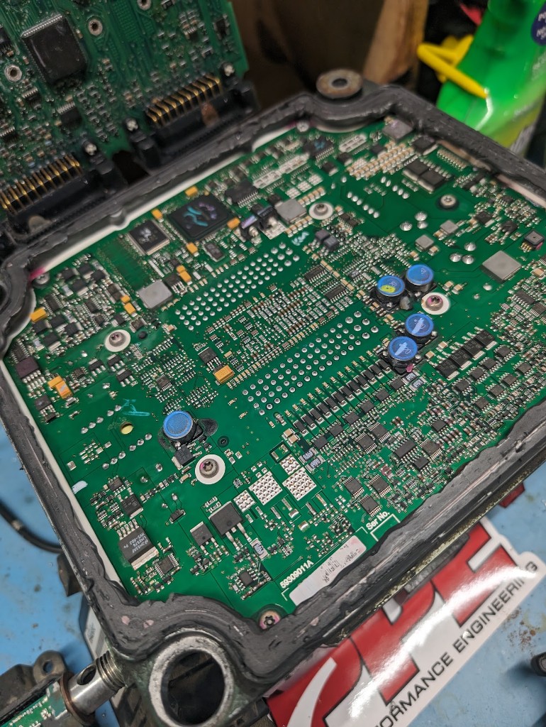 Open diesel control-module circuit board on the bench